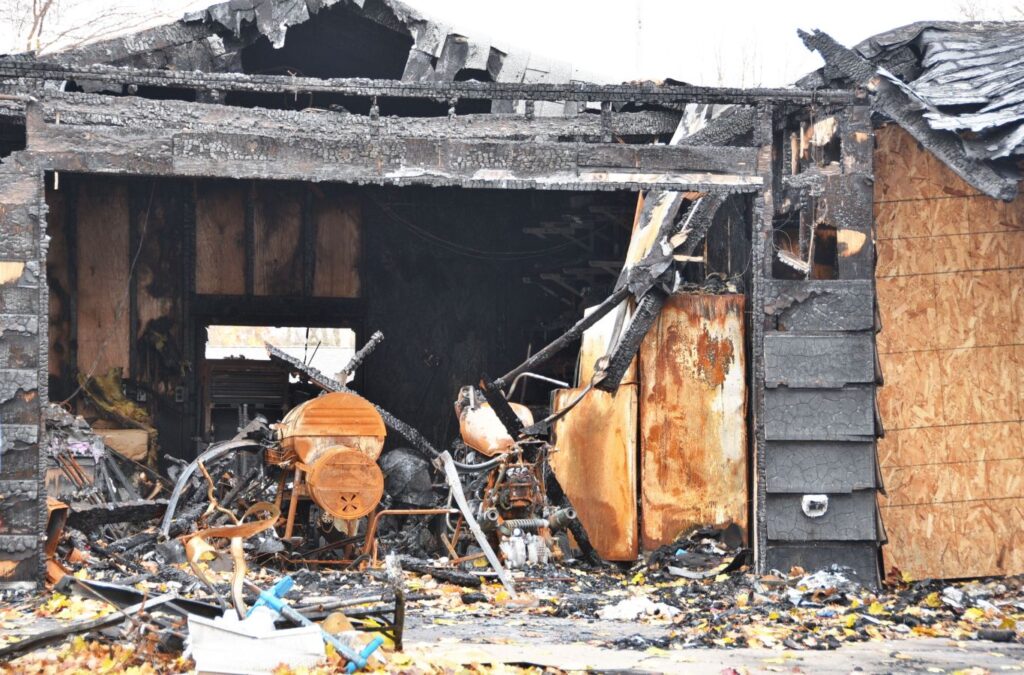 Edge Restoration specialist inspecting fire damage in a Downtown St. George, UT home, highlighting the benefits of our comprehensive services.