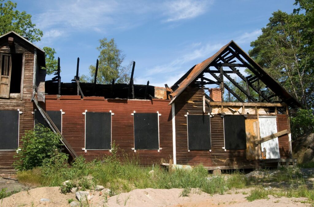 An Edge Restoration technician assessing fire damage in an Entrada, UT home, showcasing the benefits of our comprehensive restoration services.