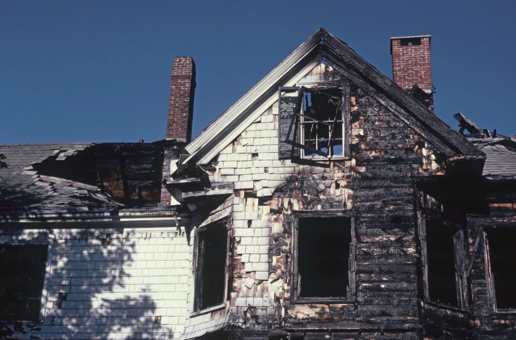 Edge Restoration specialist inspecting fire damage in a Washington, UT home, highlighting the benefits of our comprehensive restoration services.