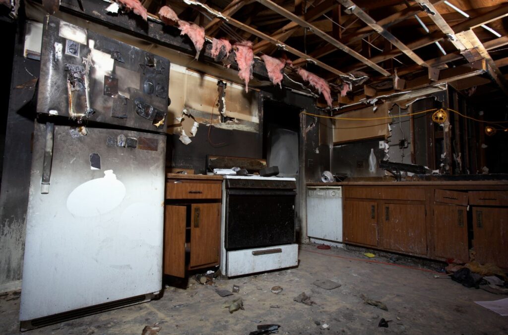 Edge Restoration expert evaluating fire damage in a Prescott Valley, AZ home, highlighting the benefits of our comprehensive restoration services.