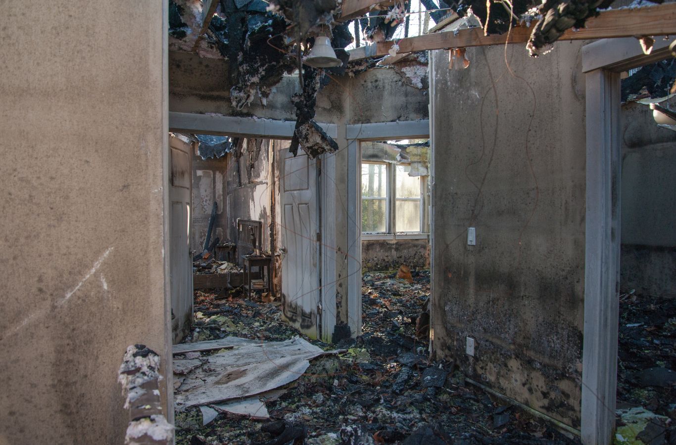 Edge Restoration technician performing fire damage cleanup in a home in Prescott Lakes, AZ, ensuring full restoration.